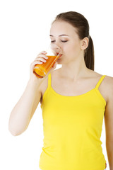 Young woman with the carrots juice