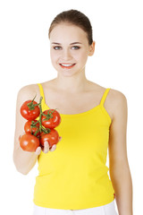 Young woman with tomato.