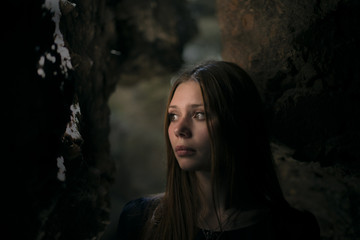 Fototapeta premium beautiful girl in a cave with a deep look