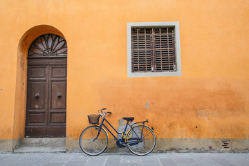 Fototapeta na wymiar Blue Bike on Orange Wall