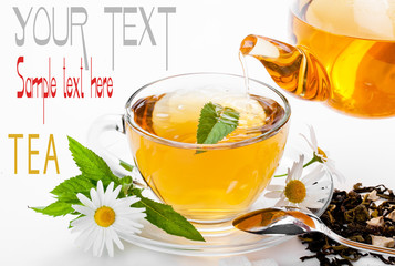 Cup with green tea and green leaves.