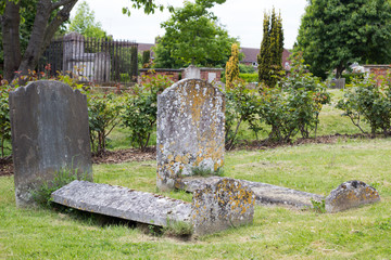 Fototapeta premium Old weathered tombs in graveyard