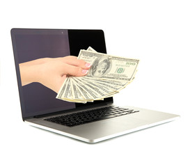 Hand giving money from laptop screen isolated on white