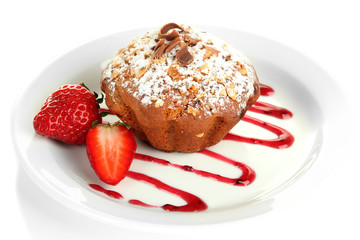 Tasty muffin cake with strawberries and chocolate