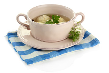 Tasty khinkali in .saucepan, isolated on white