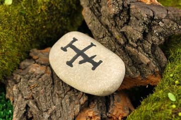Fortune telling  with symbols on stone close up