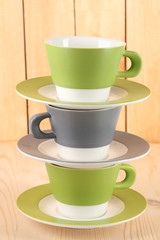 Three cups on wooden  background