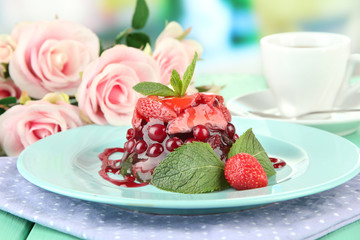 Tasty jelly dessert with fresh berries, on bright background