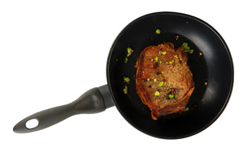 Piece of fried meat on pan isolated on white