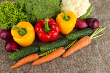 Fresh vegetables on burlap background