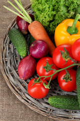 Fresh vegetables on burlap background