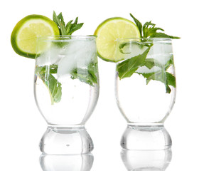 Glasses of cocktail with ice isolated on white