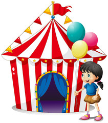 A girl with balloons in front of the circus tent