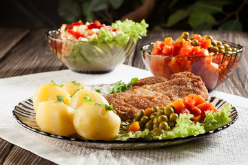Breaded chop and potatoes