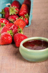 Fresh strawberries and homemade preserves