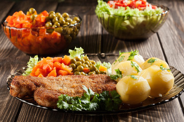 Breaded chop and potatoes