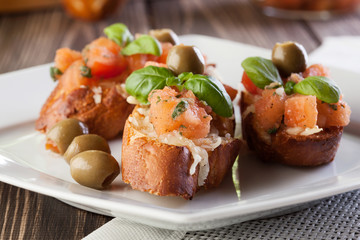 Bruschetta with mozzarella, tomato and olive