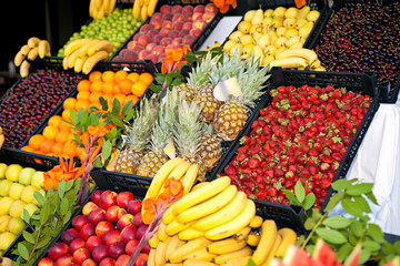 fruits and berries on display at the market
