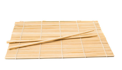 Series. chopsticks isolated on bamboo mat