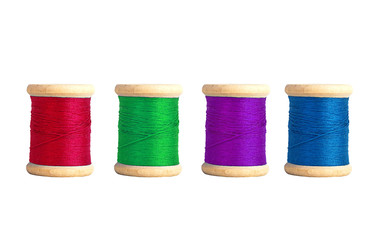 Few color bobbins isolated on white