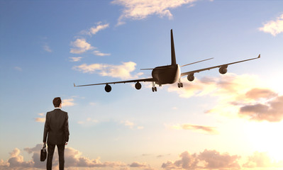 Fototapeta na wymiar businessman looking on airplane