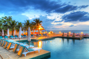 Sunset at swimming pool in Thailand