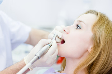 close-up medical dentist procedure of teeth polishing 