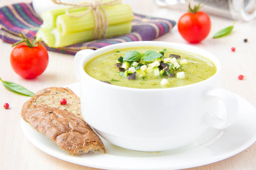 Vegetable green healthy cream soup with avocado, celery, zucchin