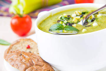 Vegetable green healthy cream soup with avocado, celery, zucchin