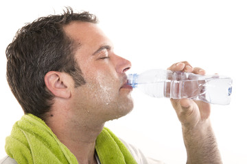 man drinking water and sweating - Powered by Adobe