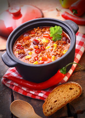 Pot of hot and spicy Mexican chili - obrazy, fototapety, plakaty