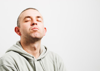 Obraz premium Man with head up and eyes closed