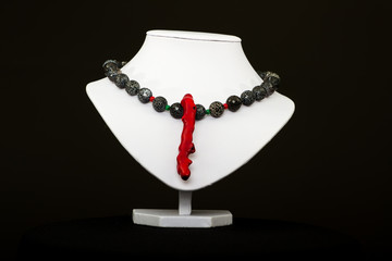 natural stone beads necklace on a stand