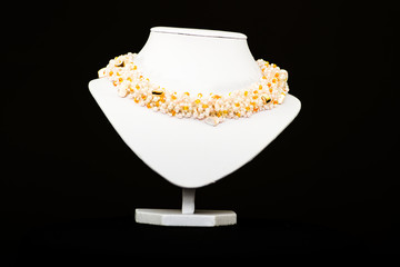 natural stone beads necklace on a stand