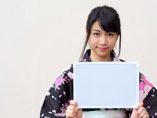 Japanese girl wearing kimono and whiteboard