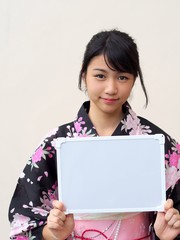 Japanese girl wearing kimono and whiteboard