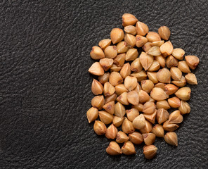 Buckwheat on black skin. macro
