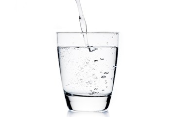 filling a glass with pure water