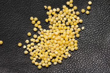 millet on a black background. macro