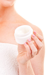 Woman hand holding facial cream