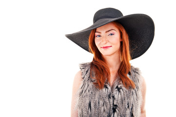 Photo of beautiful woman on a black fashion hat. Studio portrait