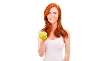 Red hair woman with green apple on white