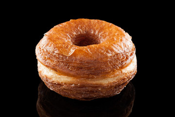 Croissant and doughnut mixture isolated on black