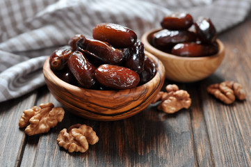 Dates fruit in a wooden bowl