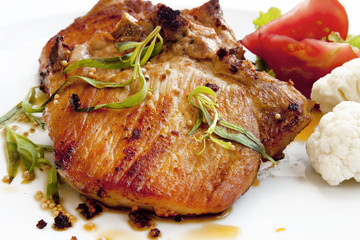 Grilled steak with spices and vegetables