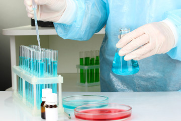 Scientist conducting research in laboratory close up