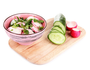 Vitamin vegetable salad in bowl with ingredients isolated