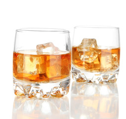 Brandy glasses with ice isolated on white