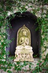 Stone statue of a Buddhist image - travel and tourism.