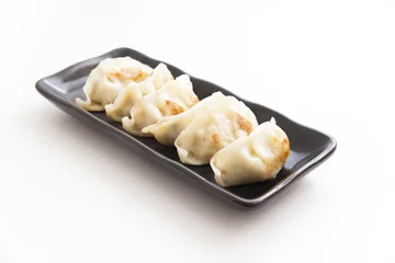 Foto op Plexiglas Japanese Dumplings with white background © elieli